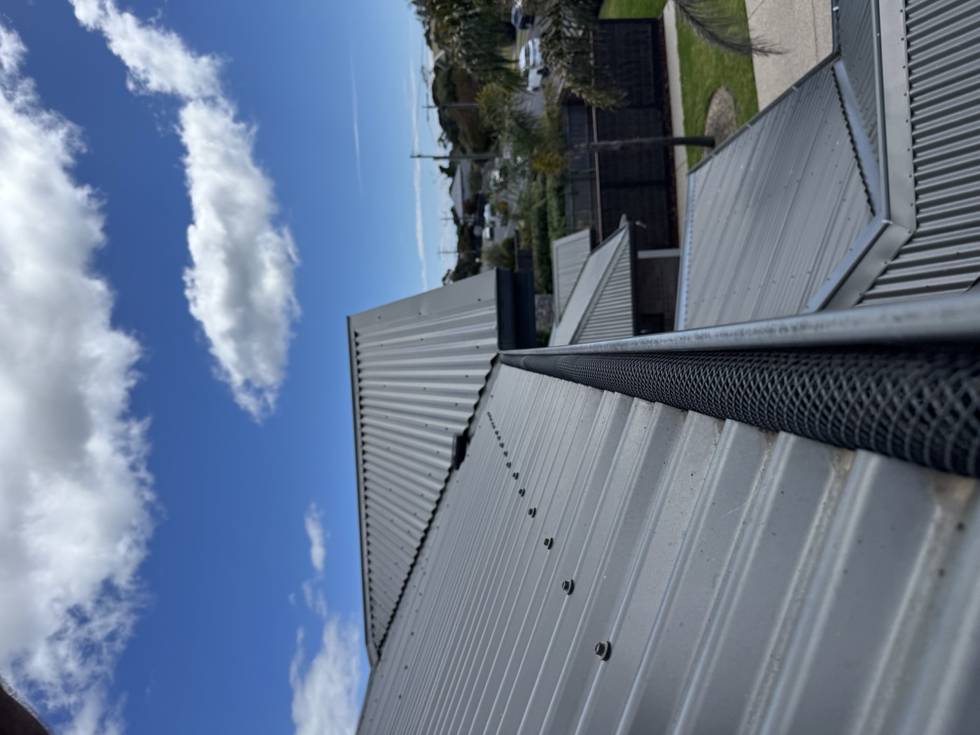 Gutter guard installation — corrugated roof